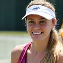 Professional headshot of Coach Sarah Lee, with a friendly expression