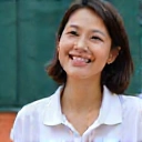 Professional headshot of Coach Emily Chen, smiling warmly
