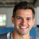 Professional headshot of Coach David Rodriguez, smiling confidently